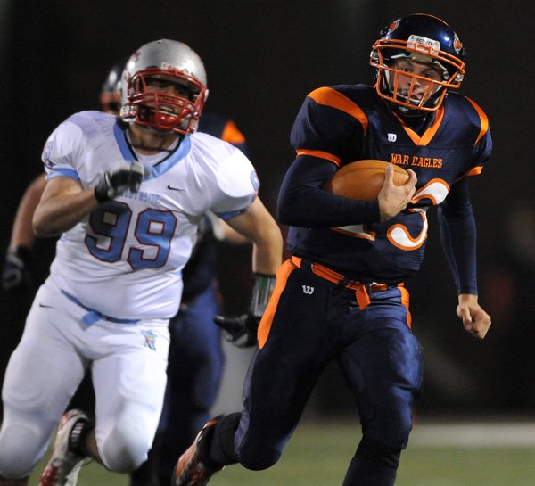 Rogers Heritage quarterback Reed Brown scrambles for a first down during then second half of the War Eagles’ game Friday against Fort Smith Southside in Gates Stadium in Rogers. Visit http://photos. nwaonline.net/ to see more photos from the event.
