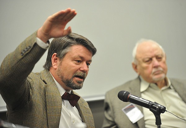 Marty Matlock (left), a professor of biological and agricultural engineering at the University of Arkansas at Fayetteville, and Petrofac founder Ralph Martin, who earned a bachelor’s and master’s degree in chemical engineering from the university, answer questions Friday about the recent Gulf oil spill during a discussion at the UA Bell Engineering building.
