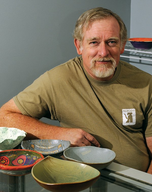 Gailen Hudson, a sponsor and volunteer with the Empty Bowls project, helps to organize and store bowls collected for the charity. The project will give ticket-buyers a bowl and soup at the Empty Bowls event on Nov. 9, which will benefit Life Source.