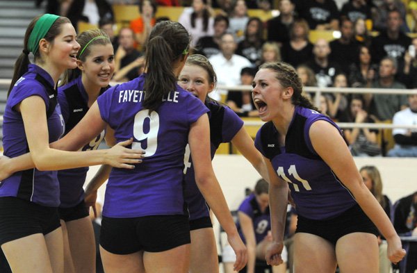 Fayetteville’s Courtney Marshall, right, screams Saturday while celebrating a point with her teammates while playing Bentonville in the Class 7A State Volleyball Tournament championship game.