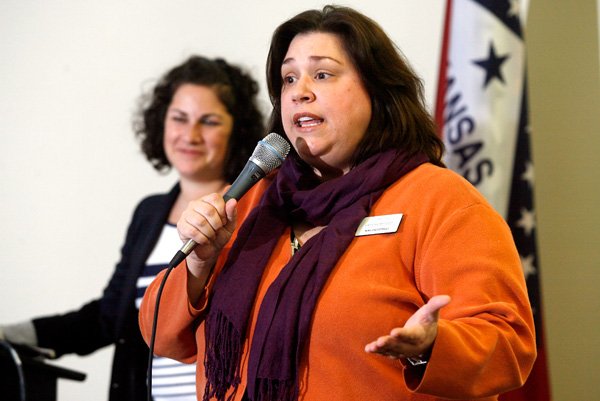 Niki Ciccotelli (right), director of education, and Eve Rosin, guided tour coordinator, speak Saturday inside the Bentonville Public Library at a volunteer guide information session at Crystal Bridges Museum of American Art.