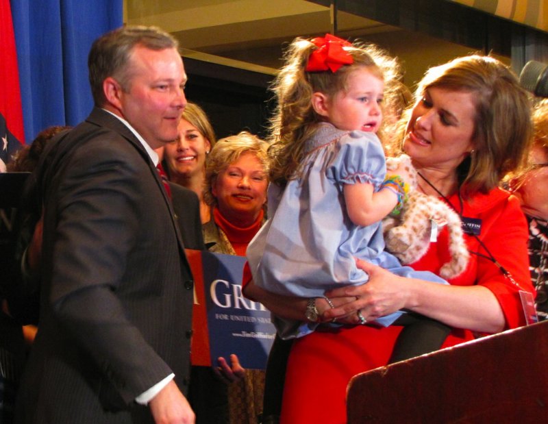 U.S. Rep.-elect Tim Griffin, along with his wife and daughter, walks on stage for a victory speech Tuesday at the Peabody.