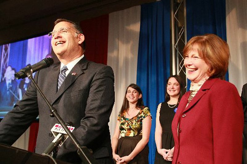  Rep. John Boozman and his wife Cathy take the stage after he was named the wiinner of the Senate race with Sen. Blanche Lincoln Tuesday night. Their daughters shown are Lauren and Shannon.
