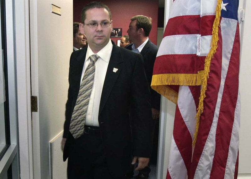 Arkansas Land Commissioner-elect John Thurston heads to a news conference at Republican Party of Arkansas headquarters in Little Rock on Nov. 3. 