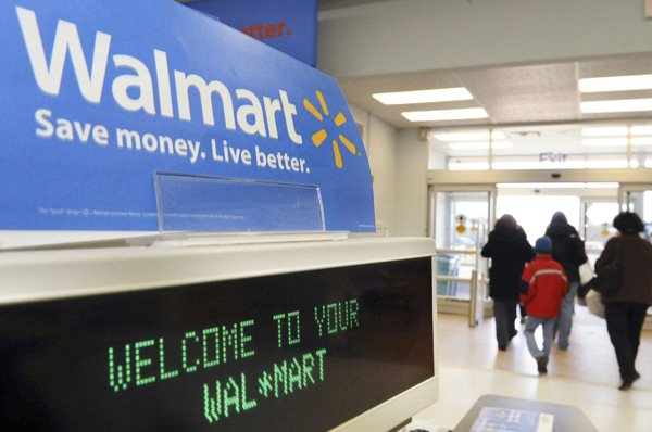 FILE - In this Feb. 17, 2009 file photo, shoppers leave a Wal-Mart in Danvers, Mass.