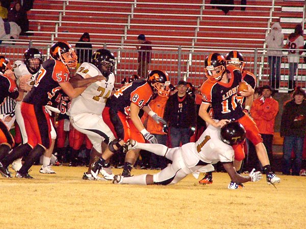 Gravette's quarterback, Clayton Alexander, finds himself with no room to run during Friday's playoff loss to Trumann on a cold and rainy night in Gravette.
