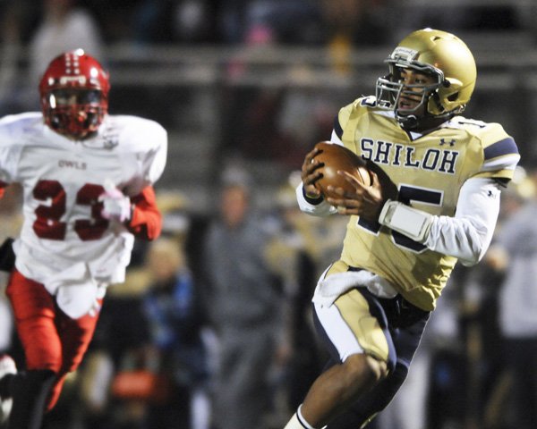 Shiloh Christian’s Kiehl Frazier catches a pass for a touchdown as McGehee’s Chase Garner gives chase in the Saints’ 58-7 victory Friday night.


