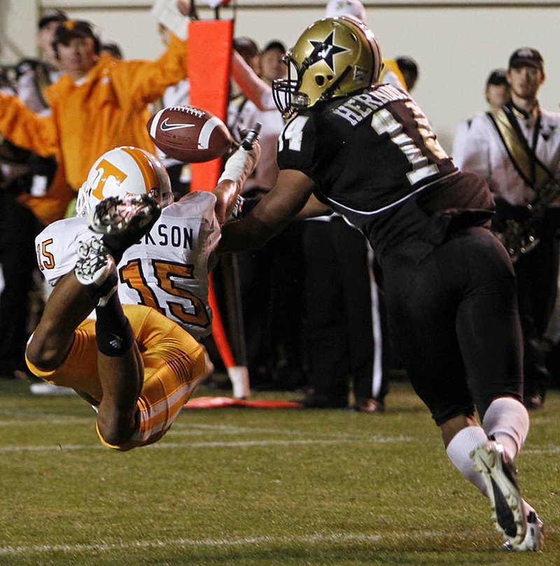 Tennessee cornerback Janzen Jackson (15) breaks up a pass intended for Vanderbilt’s Tray Herndon in the Volunteers’ 24-10 victory Saturday.

