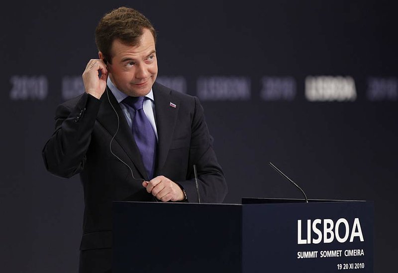 Russian President Dmitry Medvedev listens to a translation Saturday as he addresses the media at the end of the NATO.


