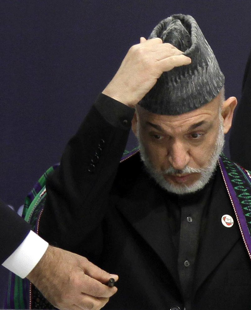 Afghan President Hamid Karzai prepares Saturday to sign an agreement with NATO concerning the future security responsibilities of his country. 