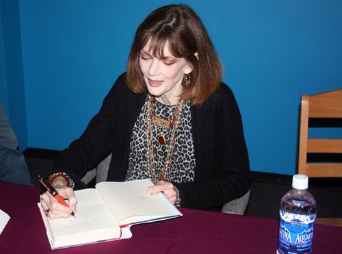 Mailer signs books after her April lecture.