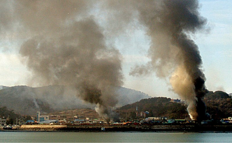 Smoke rises Tuesday over South Korea’s Yeonpyeong island after North Korea fired an estimated 200 shells at the island, prompting a return barrage by the South.