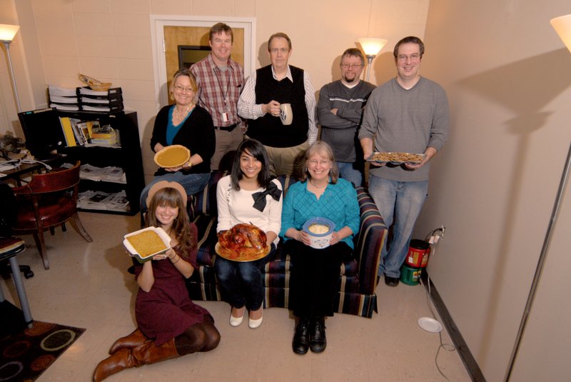 Zoned-edition staff members at the Arkansas Democrat-Gazette display their favorite dishes for the holidays. Pictured are Caroline Zilk, front row, from left, Sasha Cerrato and Karen Laskey; and Jeanni Brosius, back row, from left, Rusty Hubbard, Wayne Bryan, Dan Marsh and Jeff LeMaster.