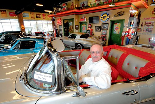 George Covington has a collection of classic cars for sale in his showroom.