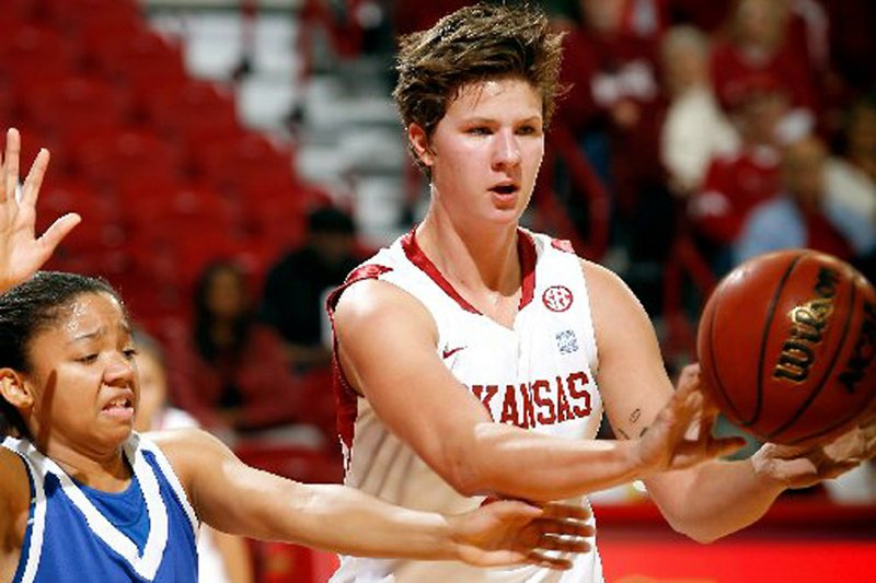  Arkansas sophomore Sarah Watkins throws a pass in front of Tennessee State senior Meredith Stafford during the first half of the Razorbacks’ 71-50 victory over the Tigers on Tuesday at Walton Arena in Fayetteville. 