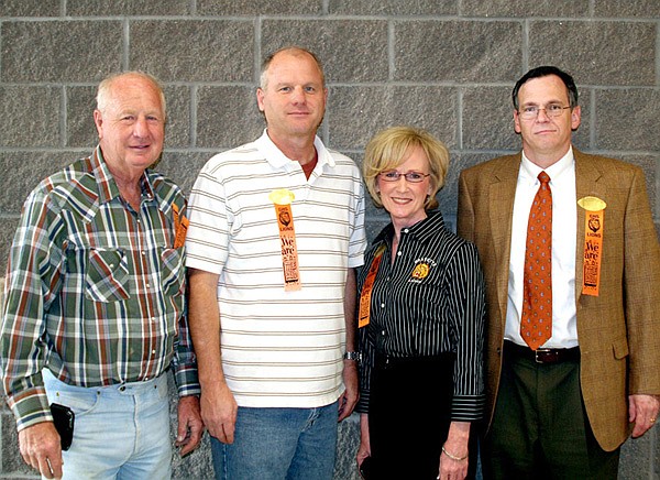 Jim Purcell, right, Director of the Arkansas System of Higher Education, with, from the left, State Senator Kim Henden, Jim Hendren, member of the Gravette school board, and Superintendent of Schools Andrea Kelly.
