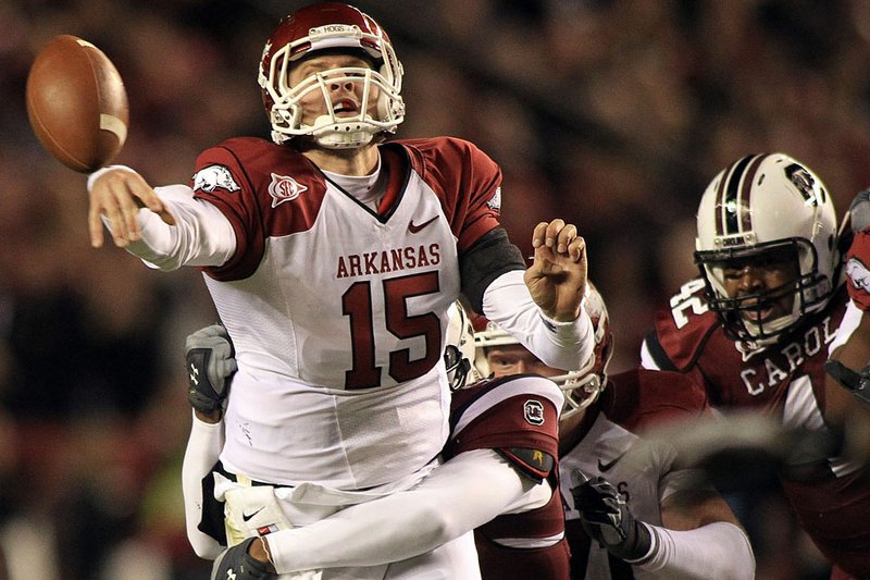 Ryan Mallett throws the ball just before being tackled by the South Carolina defense during the first half of the Razorbacks game in South Carolina.