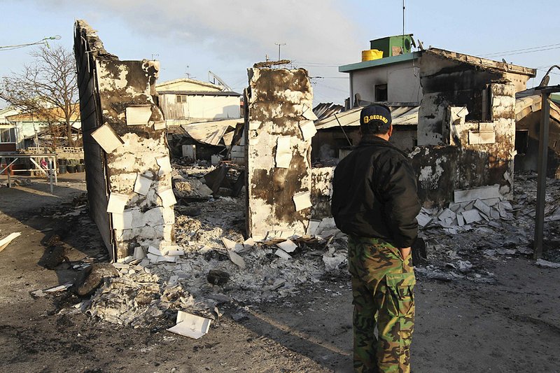 A South Korean man on Wednesday inspects homes destroyed by North Korea’s artillery barrage Tuesday on Yeonpyeong island. 