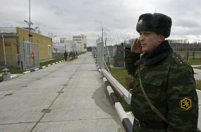 A Russian officer stands at the entrance of Russia's plant for destruction of chemical weapons during an open ceremony of in Pochep, 250 miles southwest of Moscow, Russia, Friday, Nov. 26, 2010. 