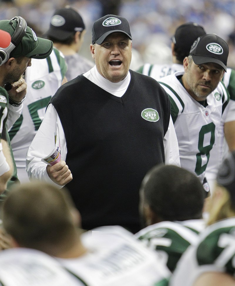 Coach Rex Ryan (center) and the New York Jets, which beat Cincinnati 26-10 Thursday, will square off with the New Engand Patriots next week in a matchup between the two teams with the best records in the NFL.

