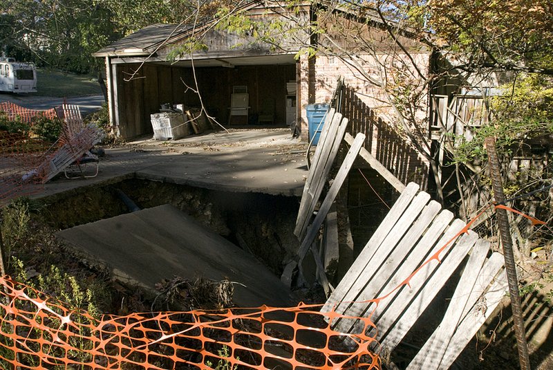 Little Rock wants to condemn and raze this house at 126 White Oak Lane, where a drainage pipe collapsed years ago, causing flooding and damage to the home’s foundation.

