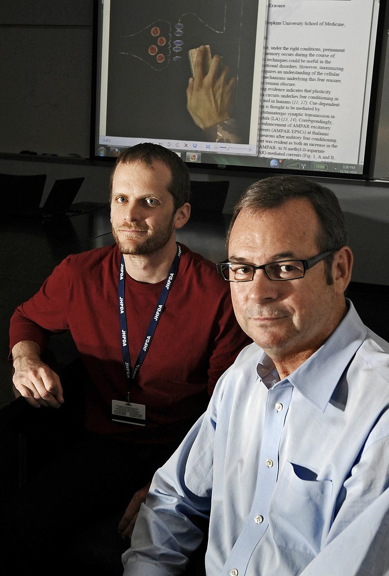 Roger Clem (left) and Richard Huganir have co-published an article in Science magazine that explores the idea of erasing memories. 
