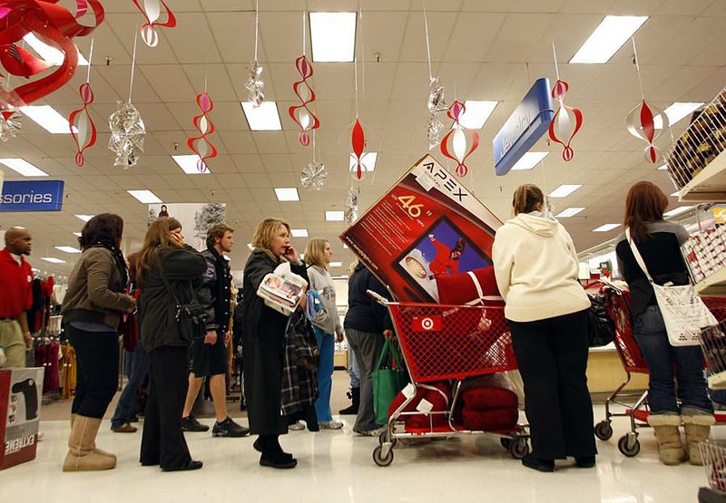 Shoppers line up to check out at the Target in North Little Rock on Friday. 