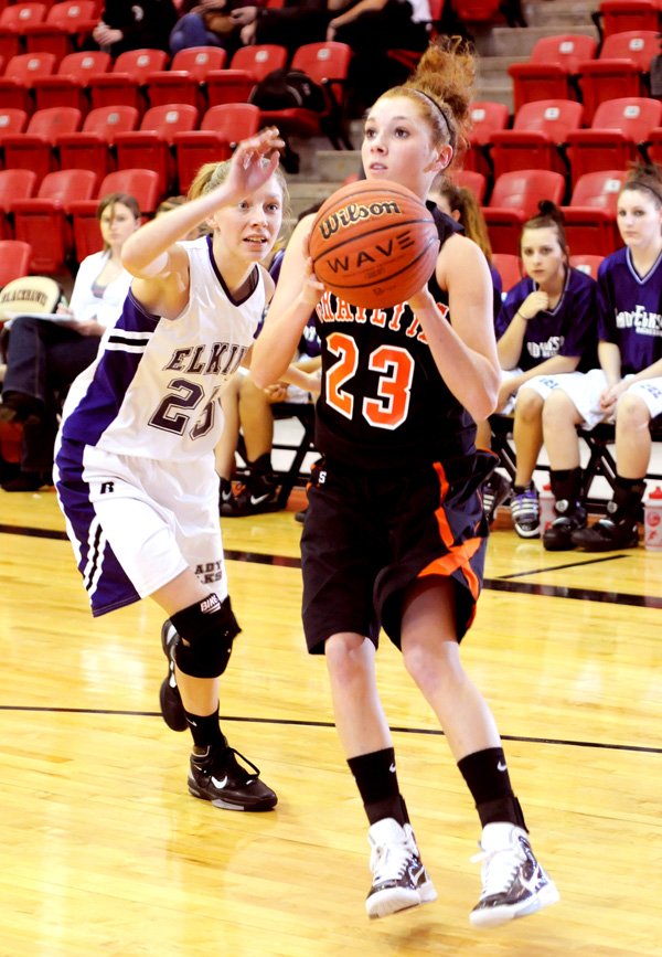 Gravette's Kyndra Meeker shoots the ball as Elkins Tanya Hankins defends in the first half Monday November 29, 2010 in Pea Ridge.
