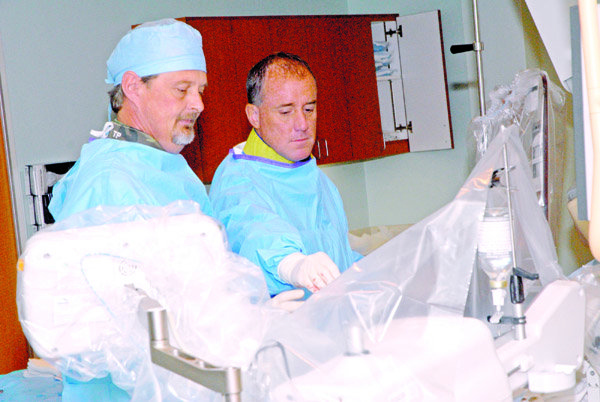 Tom Pelton and Dr. Jeffery Tauth perform a cardiac catheterization procedure in the Heart and Vascular Center at St. Joseph’s Mercy Health Center in Hot Springs.