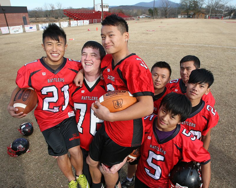 Magazine lineman Skyler McElroy may tower over teammates Long Yang (left) and Chang Yang, but there is no escaping the impact Hmong players have had on Magazine’s success.The Yangs and fellow Hmong players Charly Moua (5), Bobby Moua (left rear), Jay Moua (center rear) and Toto Yang (right rear) have all helped Magazine advance to Saturday’s Class 2A state title game against Danville. 