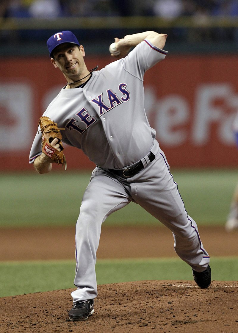  Texas Rangers' Cliff Lee pitches during the first inning against the Tampa Bay Rays during Game 5 of baseball's American League Division Series, Tuesday, Oct. 12, 2010, in St. Petersburg, Fla. 