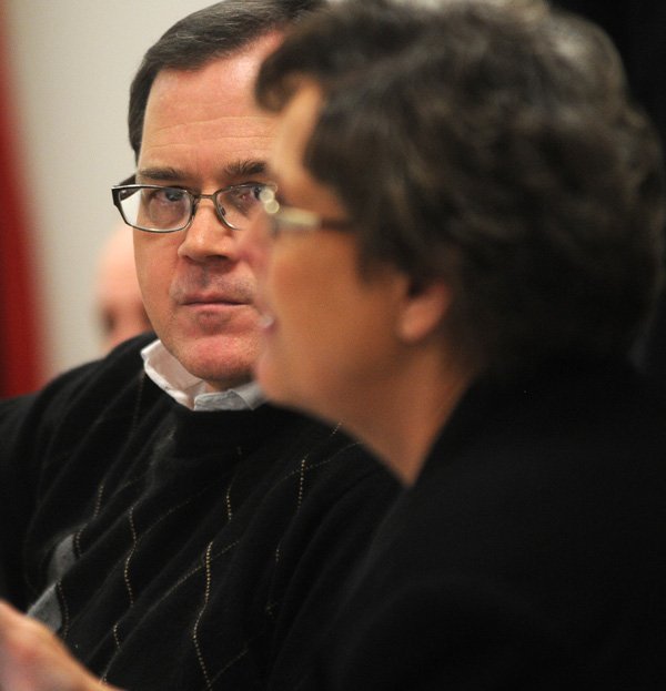 Mark Kinion, incoming Fayetteville alderman, listens Wednesday to city clerk Sondra Smith explain City Council procedure before a tour of the city offices for new aldermen.