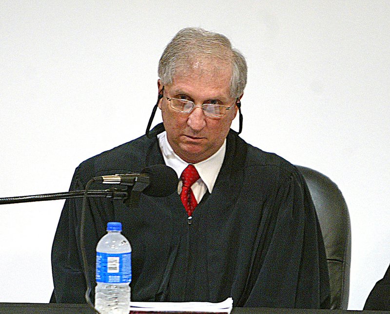  Arkansas Supreme Court Justice Paul Danielson gets ready to hear oral arguments on a case involving the city of Hot Springs' wastewater fees Thursday, April 30, 2009, at the Roy Rowe Auditorium. 