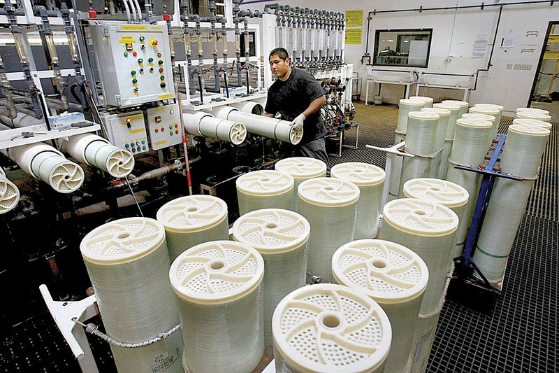 Jorge Estrada of Hydranautics tests reverse-osmosis membranes used for desalination of seawater in Oceanside, Calif. 
