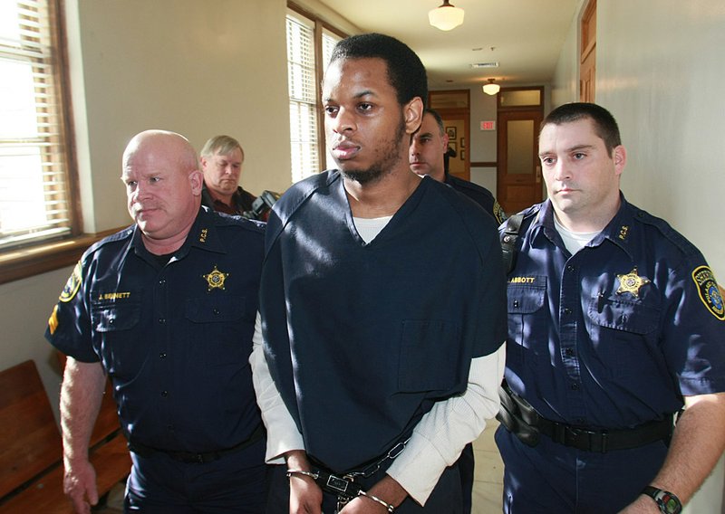 Abdulhakim Mujahid Muhammad is taken to a hearing Tuesday at the Pulaski County Courthouse.