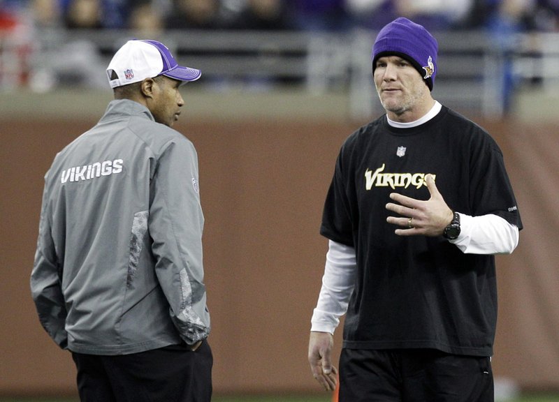 Minnesota Vikings quarterback Brett Favre, right, talks with head coach Leslie Frazier during pre-game warm-ups before an NFL football game against the Detroit Lions in Detroit, Sunday, Jan. 2, 2011. 