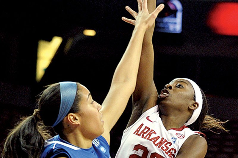 Arkansas’ C’eira Ricketts pulls up for a shot against Kentucky’s Samantha Drake on Thursday night at Walton Arena in Fayetteville. Ricketts had a game-high 19 points in a 78-67 Razorbacks victory. 