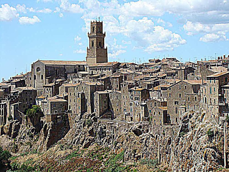  The ancient Tuscan hilltown of Pitigliano, known as Little Jerusalem, rises from volcanic rock over densely forested ravines.                