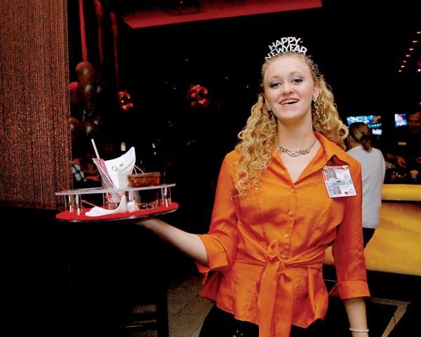 Adrienne Dickson serves drinks at Oaklawn Park during the $5,000 New Year's Eve Extravaganza.