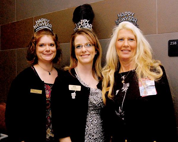 Shanna Wells, from left, Melissa Williams and Rhonda Hastings, staff members at Lagniappe's at Oaklawn Park, don some festive party favors.