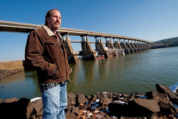 Mark Spitzer stands near the Toad Suck Dam, where the state’s largest population of alligator gar is found.