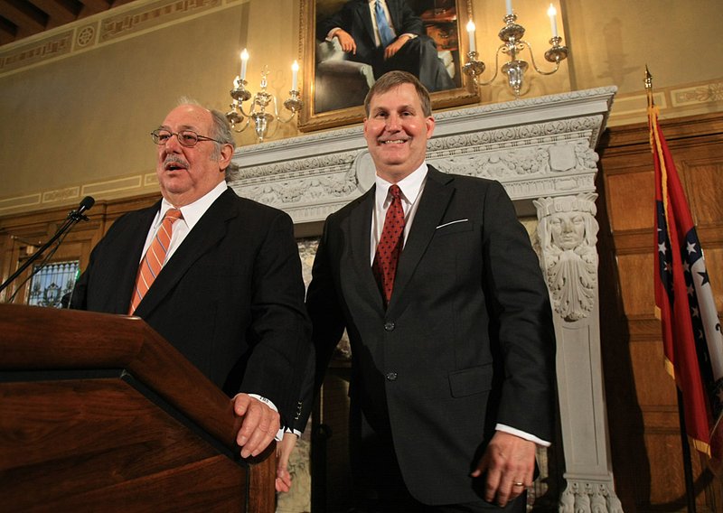 New state highway commissioners Tom Schueck (left) and John Burkhalter appear Friday at a Capitol news conference.

 
