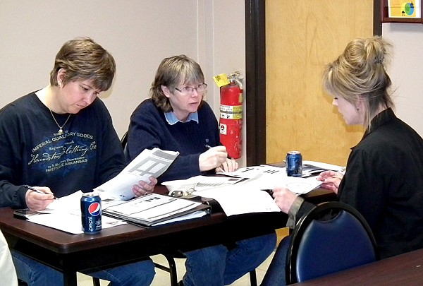 Decatur high school teachers met on Friday to discuss how to improve student's college readiness. Pictured are teacher Tracy Howard, counselor Nancy Cotter and special programs coordinator Dawn Steward.
