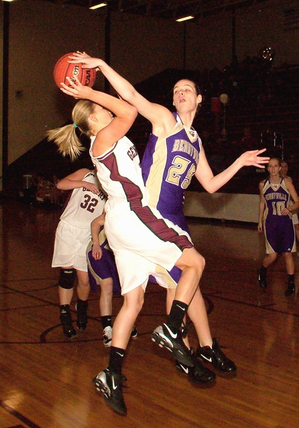 Gentry sophomore Tara Arnold attempts a shot under the basket Friday against a Berryville defender.