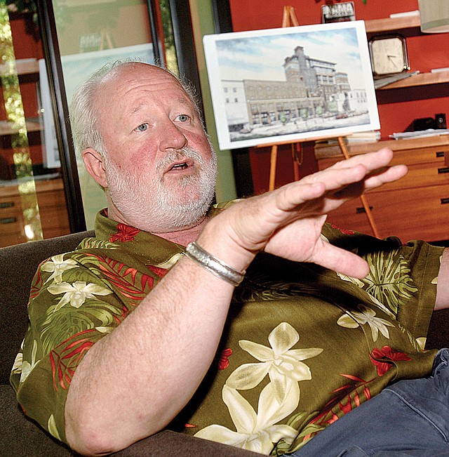  Richard Alexander talks about the Renaissance Tower Project at his Fayetteville office. 