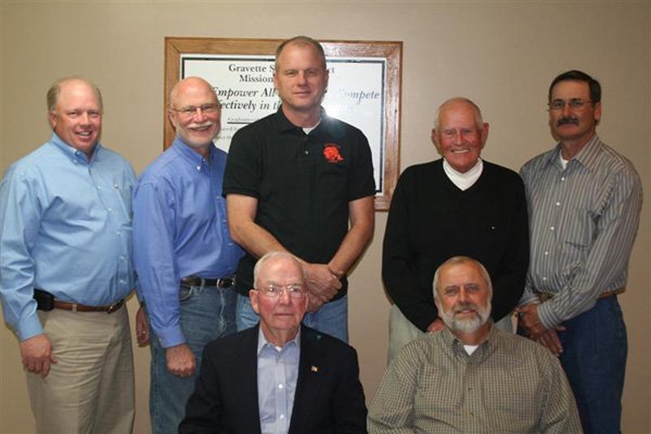 The Gravette Board of Education is an elected group of seven members. John Edwards (front, left) and board president Marion Harris, Jim Singleton (back, left), vice president Dan Yates, Jim Hendren, Jack Skillett and Danny Alsup.
