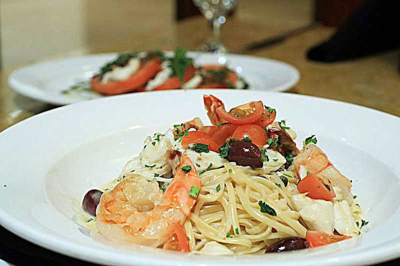 Linguine Pescatore, featuring shrimp, crab, fish, capers, tomatoes and olives in a white wine butter sauce ($22.95) is a pasta selection at Capriccio Grill. 