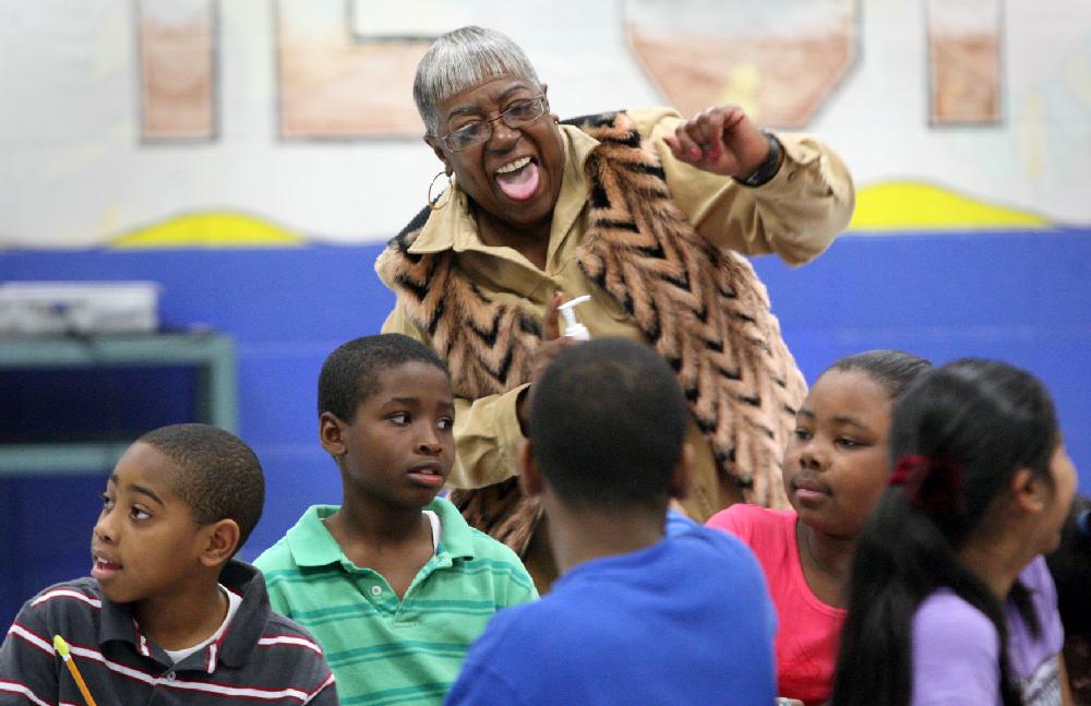 2/6/11
Arkansas Democrat-Gazette/STEPHEN B. THORNTON
Teacher Barbara Beavers keeps dancing to the rythym of the beat even after her fifth grade students have settled into writing in their work books during a fast-paced writing workshop Monday morning at Watson Intermediate Elementary School in Little Rock. The presentatation entitled "Rap, Rhythm & Rhyme: Rebuilding the Writing Foundation" used dance and music to inspire students increased vocabulary in their writing.