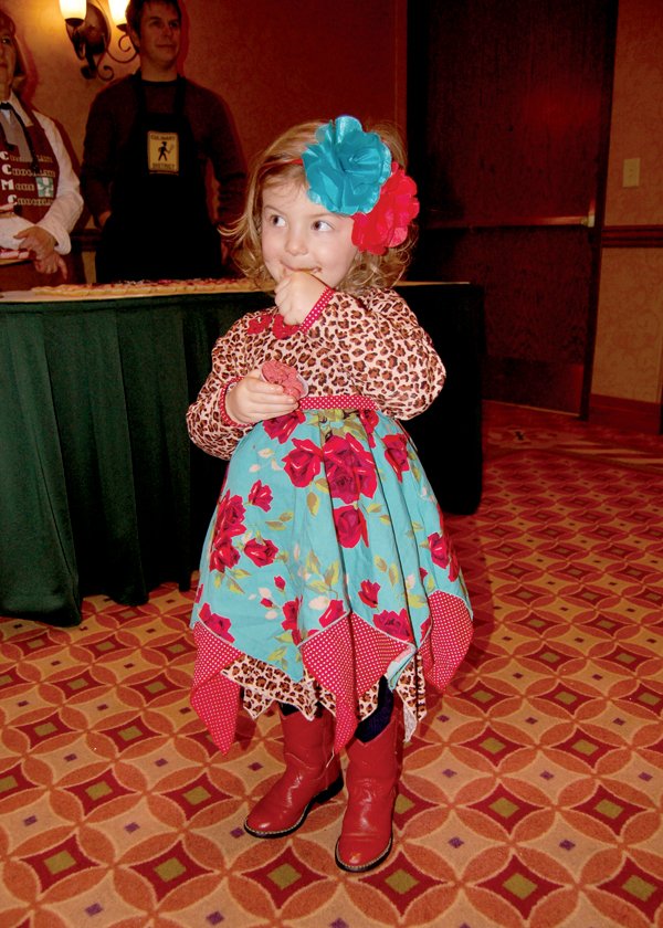 Mattie Everhart, 2, of Hot Springs enjoys some sweet treats at the Chocolate Festival, held Sunday in Hot Springs. The annual event benefits the Charitable Christian Medical Clinic.