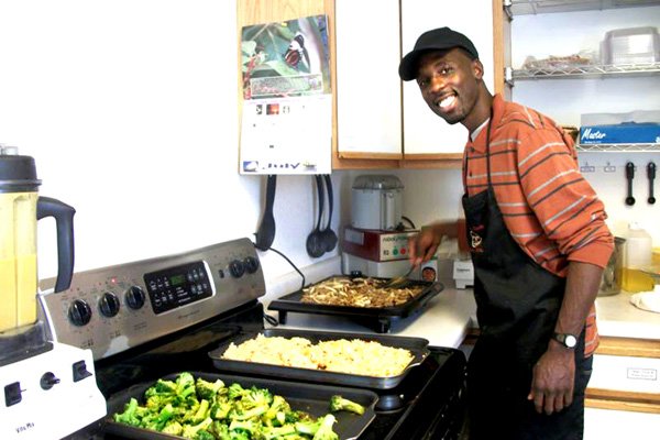 Chef GW Chew prepares some plant-based food in the Wellness Secrets kitchen.